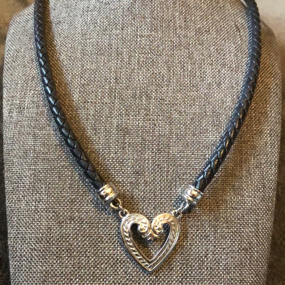 Premier design necklace silver tone and leather cording.